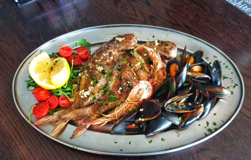 Fresh fish platters at Moby Dick Bar & Restaurant in Xlendi Gozo